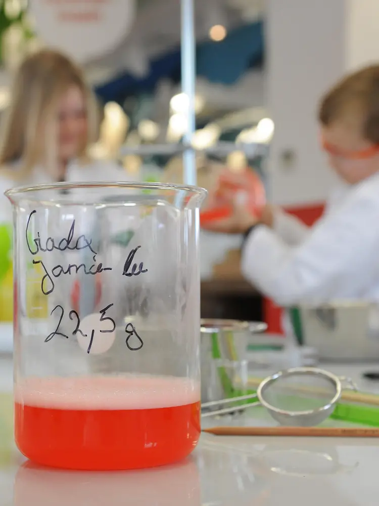 close up of beaker with red liquid