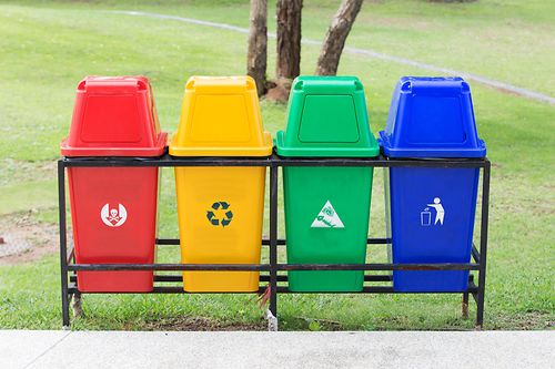 4 waste containers in red, yellow, green, blue