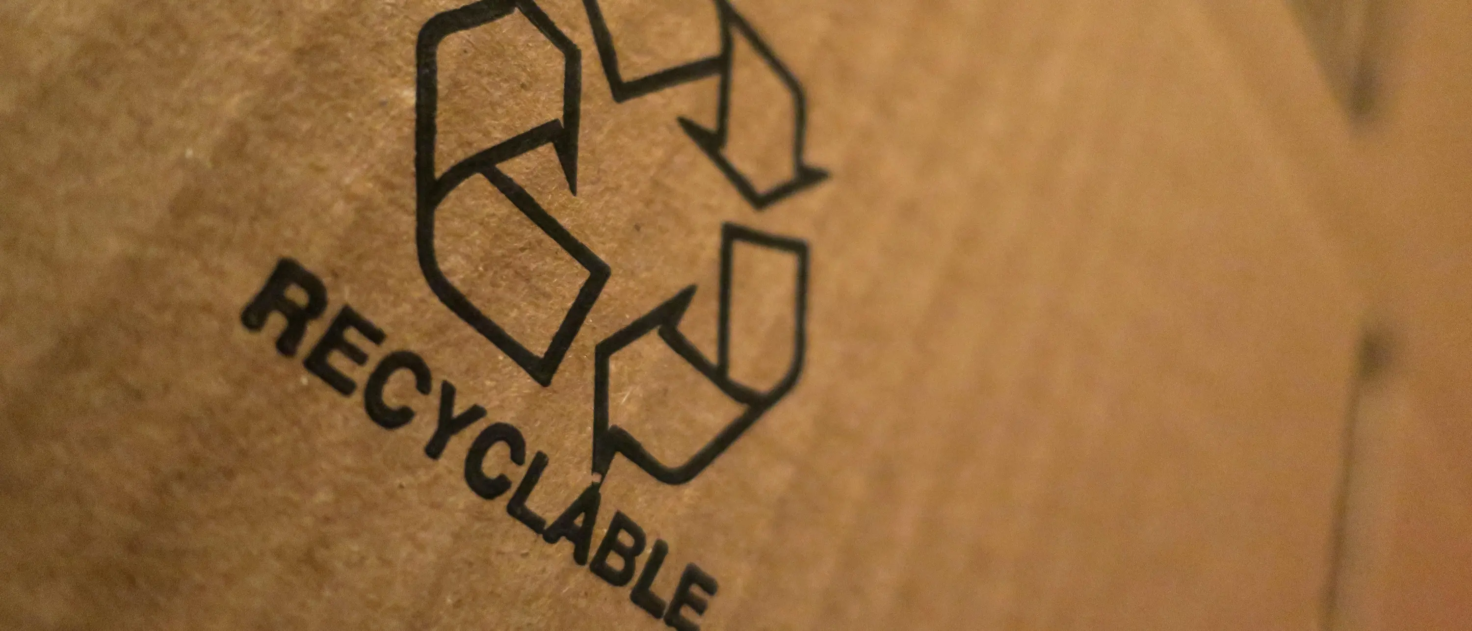 recycling symbol on piece of card board