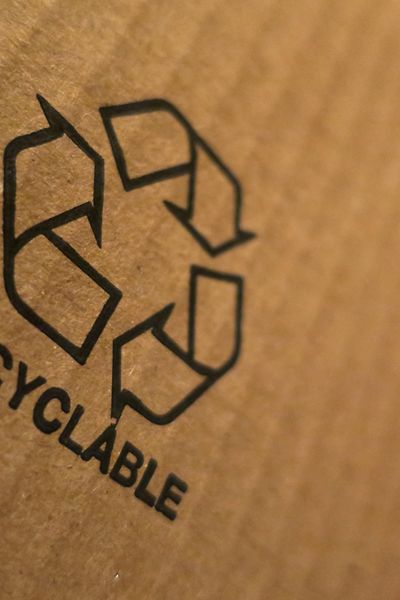recycling symbol on piece of card board
