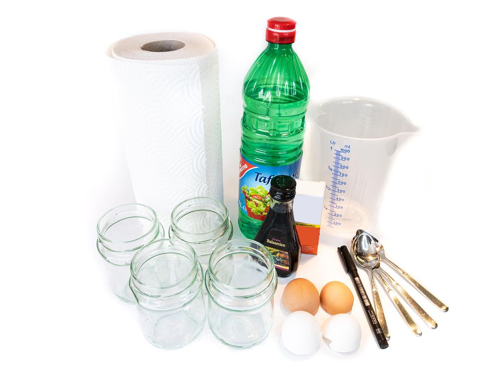 vinegar, measuring jug, glass jars, eggshells and paper towels