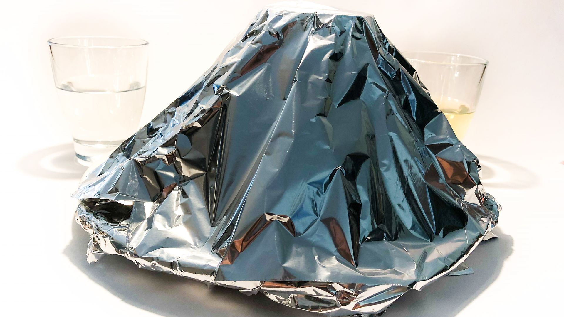 cone of aluminum foil on plate